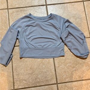 This shirt is a light blue compression shirt.